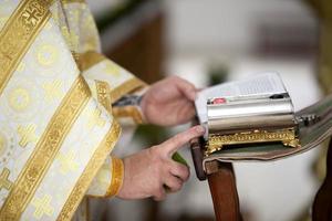 The priest's hands hold a church attribute.Preparing for the church service photo