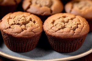 Homemade muffins with cinnamon and almonds on a black background. photo