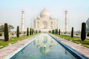 The Taj Mahal is an ivory-white marble mausoleum on the south bank of the Yamuna river in the Indian city of Agra, Uttar Pradesh. photo
