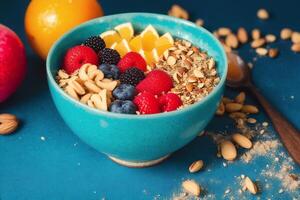 sano desayuno. harina de avena con bayas y nueces en un azul cuenco en un vistoso antecedentes. generativo ai foto