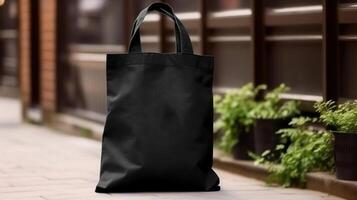 , Realistic black tote canvas fabric bag set-up in at interior or outdoor, shopper mock up blank. photo