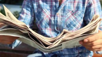 Man reading newspaper video