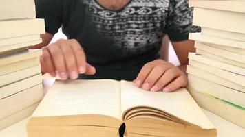 University student research while using a retro method, student using many books instead of internet to do research, selective focus video