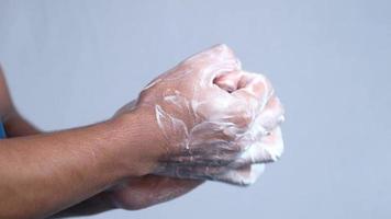 slow motion of young man washing hands with soap warm water video