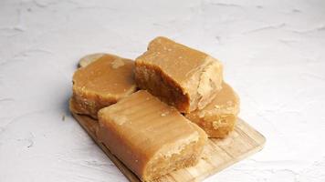 close up of brown sugar cube on table video