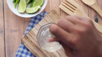 Refreshing lemon water drink on table , top view . video