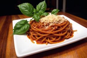 Spaghetti pasta with parmesan cheese and parsley on a plate. photo