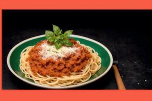 Spaghetti pasta with parmesan cheese and parsley on a plate. photo