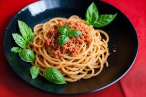 Spaghetti pasta with parmesan cheese and parsley on a plate. photo