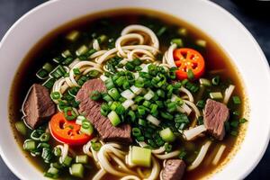 Japanese ramen noodle soup with beef and green onion in bowl. Beef soup. photo