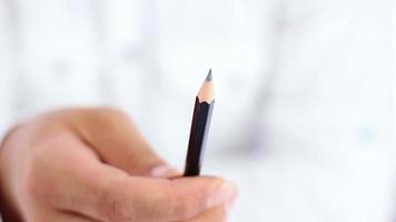 Person sharpening pencil video