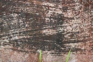 photo of red wall texture with cement on the wall