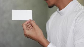 photo of blank white card in hand