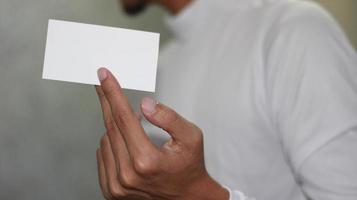 photo of blank white card in hand