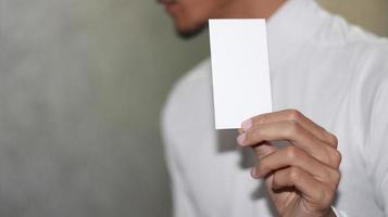 photo of blank white card in hand