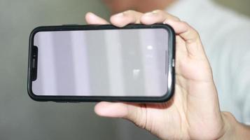 blanco pantalla Teléfono móvil foto en mano