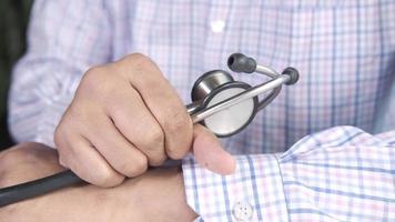 Close up of doctor with arms crossed holding stethoscope video