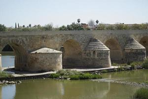 Roman Bridge on Guadalquivir River in Cordoba, Spain photo