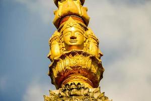 Golden statue in a Thai temple photo
