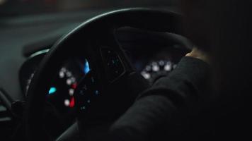 Close-up view of the male hands on the steering wheel driving the car video