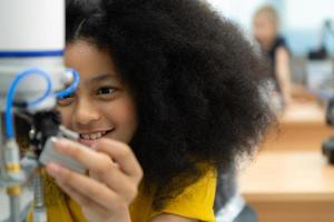 Children using the hand robot technology, Students are studying technology, which is one of the STEM courses. photo