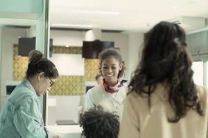 Airline ground staff help passengers check their tickets and passports for travel. photo