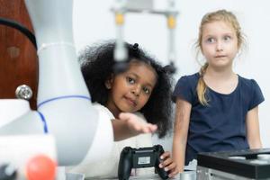 Children using the hand robot technology, Students are studying technology, which is one of the STEM courses. photo