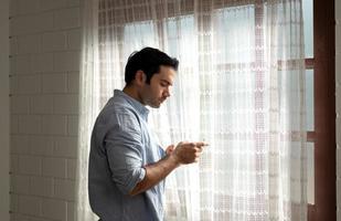 LGBT Young men use computers to communicate with their peers. on the days at home cannot go out. photo