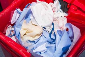 Biological risk waste disposed of in the red trash bag at a operating room in a hospital photo