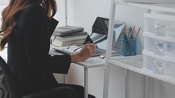 Financial analysts analyze business financial reports on a digital tablet planning investment project during a discussion at a meeting of corporate showing the results of their successful teamwork. video