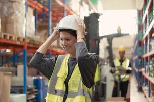 Manager with foreman and warehouse personnel, Manage and monitor inventory preparation for distribution to regional sub-centers. photo