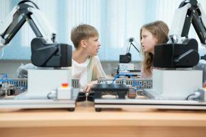 Children using the hand robot technology, Students are studying technology, which is one of the STEM courses. photo