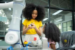 Children using the hand robot technology, Students are studying technology, which is one of the STEM courses. photo
