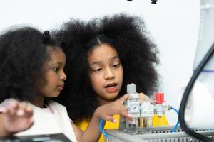 Children using the hand robot technology, Students are studying technology, which is one of the STEM courses. photo