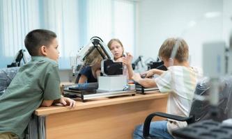 Children using the hand robot technology, Students are studying technology, which is one of the STEM courses. photo