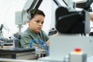 Children using the hand robot technology, Students are studying technology, which is one of the STEM courses. photo