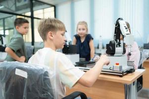 Children using the hand robot technology, Students are studying technology, which is one of the STEM courses. photo