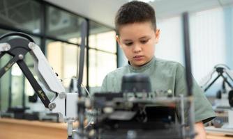 Youngsters utilizing the hand robot technology are having fun learning the hand robot controller of robot technology, which is one of the STEM courses. photo