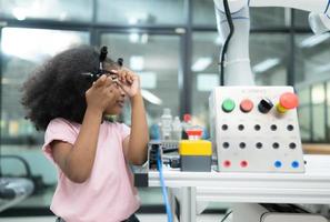 Youngsters utilizing the hand robot technology are having fun learning the electronic circuit board of hand robot technology, which is one of the STEM courses. photo