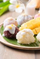 coconut milk on sticky rice with ripe mango photo