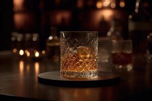 Rich whiskey in a glass, poised elegantly on a wooden table. photo