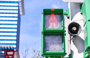 Red traffic light in the city photo