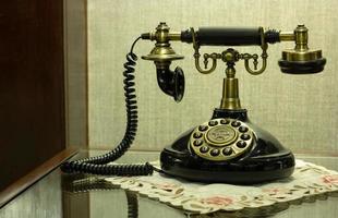 Antique Telephone on Table at Hotel Lobby photo