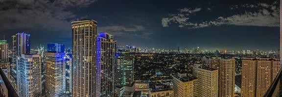 Panoramic image over Manila skyline at night photo