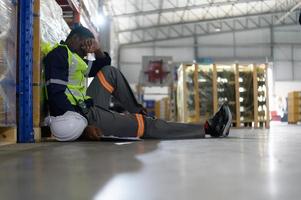 Head of worker in an auto parts warehouse, Sit back and relax after examine auto parts that are ready to be shipped to the automobile assembly factory. photo