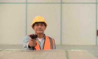 Workers inspect the new warehouse's products. Use barcode scanners to check the products that will be used in the warehouse shelf structure. photo