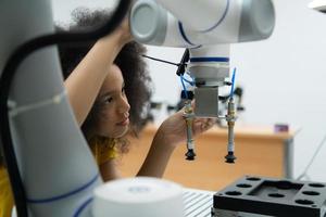 Children using the hand robot technology, Students are studying technology, which is one of the STEM courses. photo