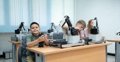 Children using the hand robot technology, Students are studying technology, which is one of the STEM courses. photo