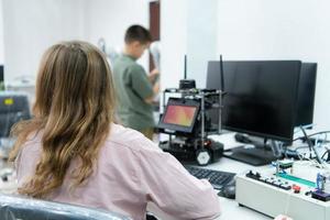 Youngsters utilizing the hand robot technology are having fun learning the electronic circuit board and hand robot controller of robot technology, which is one of the STEM courses. photo