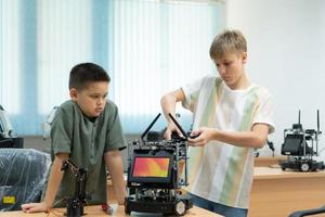 Children using the hand robot technology, Students are studying technology, which is one of the STEM courses. photo